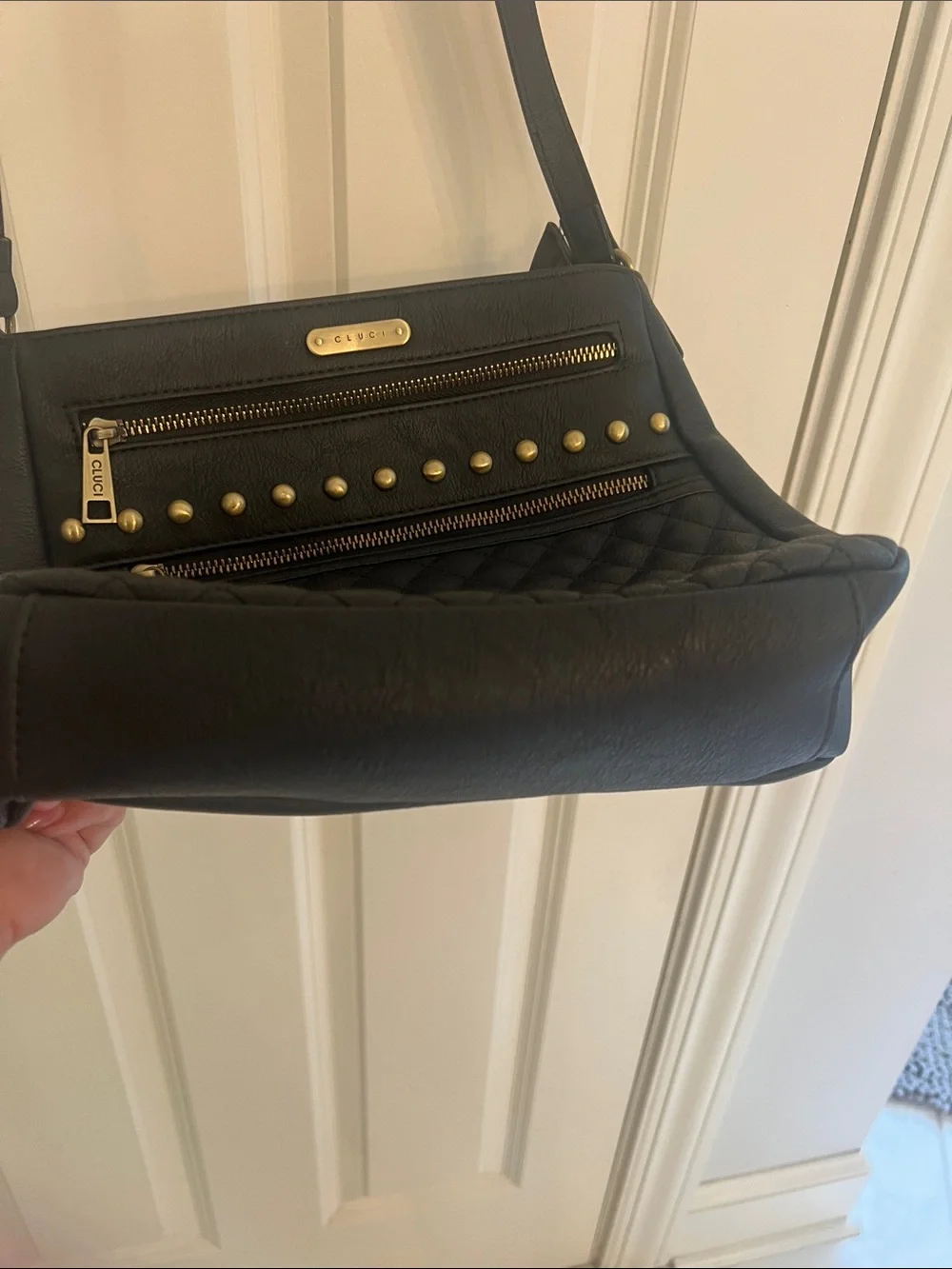 Black Quilted Crossbody Bag with Tassel and Stud Details